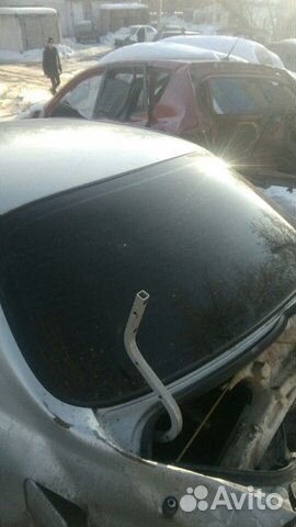 Стекло заднее Kia Spectra