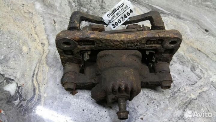 Суппорт тормозной задний левый Kia Sorento (2002