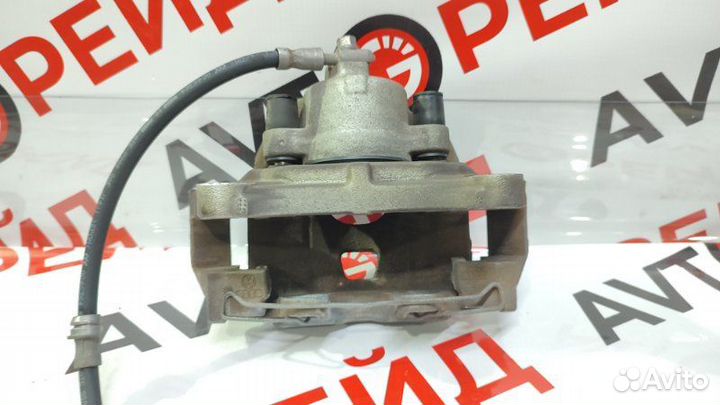 Суппорт тормозной передний левый Volkswagen Tiguan