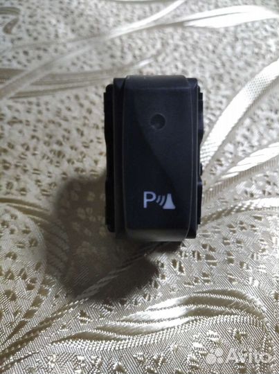 Кнопка парктроника Renault Logan