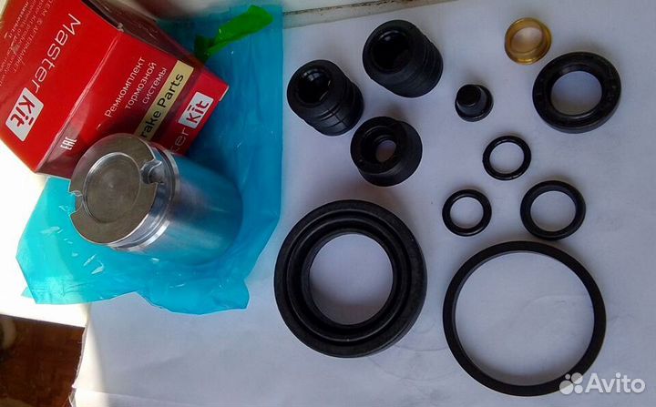 Ремкомплект заднего суппорта Ауди 100 80 с поршнем