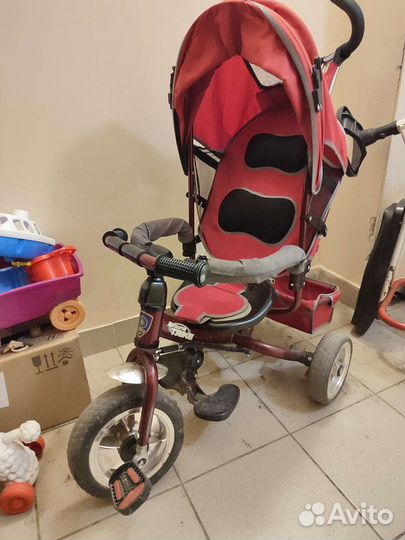 Трехколесный велосипед с ручкой