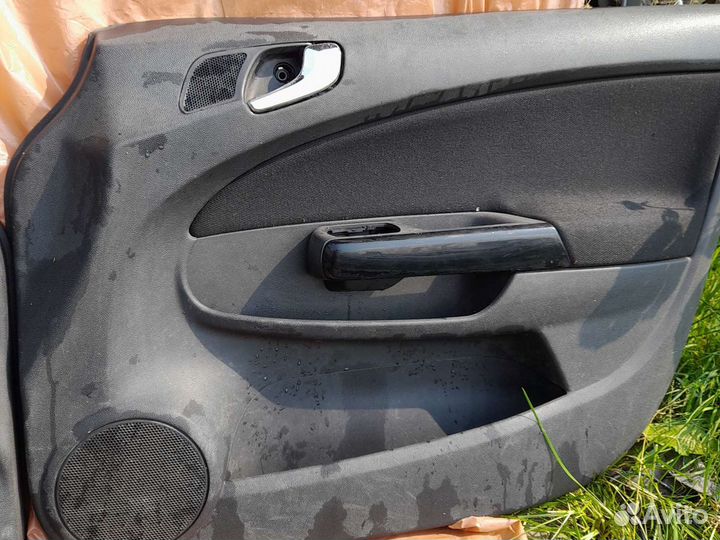 Обшивка дверей Опель Корса D