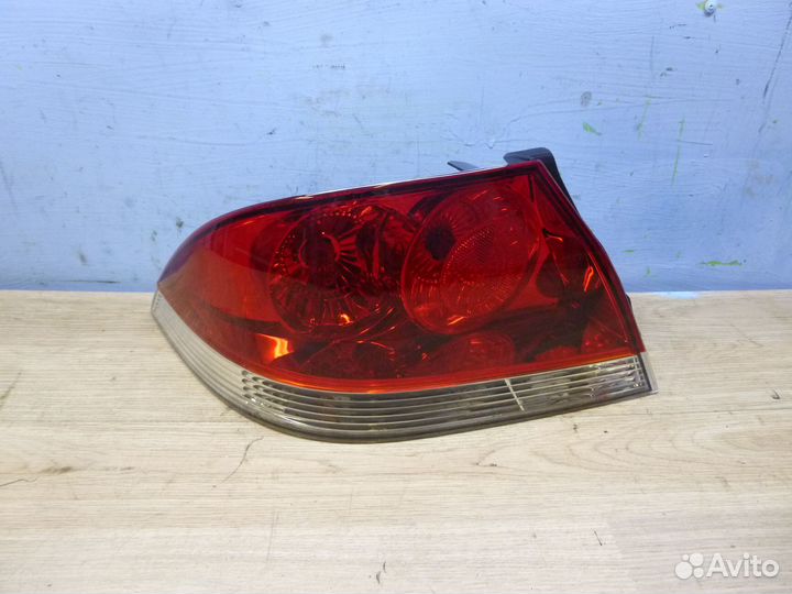 Фонарь задний левый mitsubishi lancer 03-07