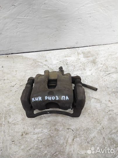 Суппорт тормозной передний левый Kia Rio 3