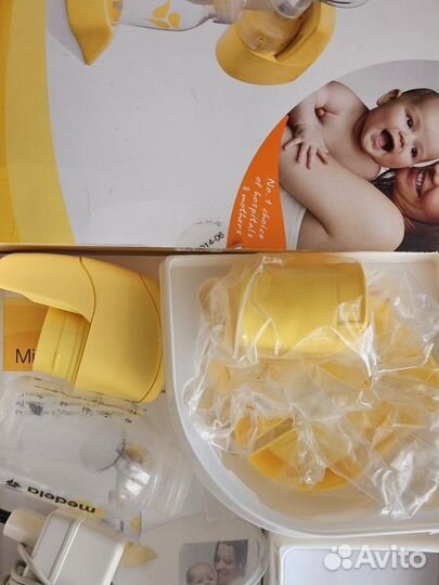 Молокоотсос medela электрический