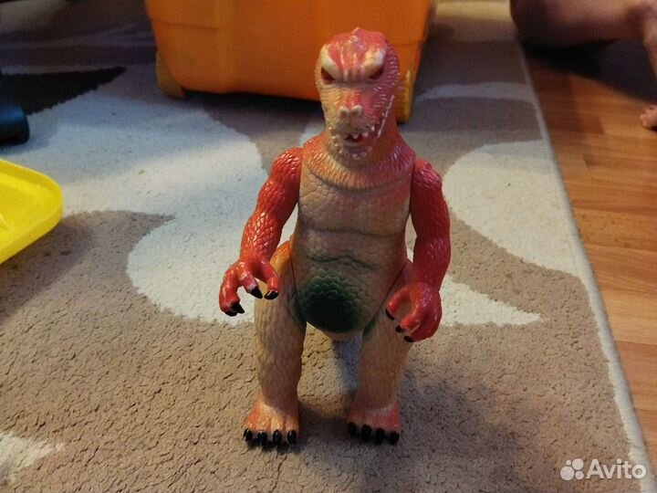 Детская игрушка динозавр
