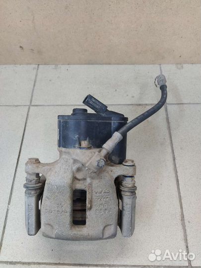 Суппорт тормозной задний левый Фольксваген Тигуан