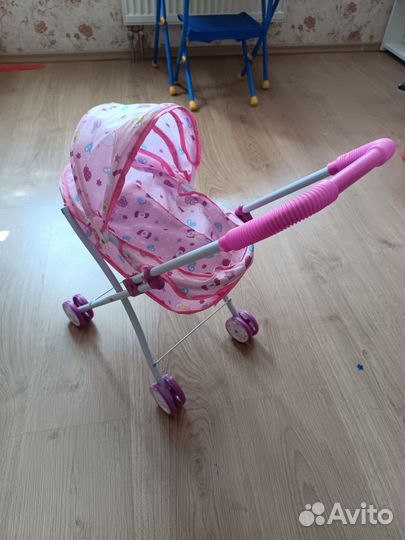 Игрушечная коляска для кукол