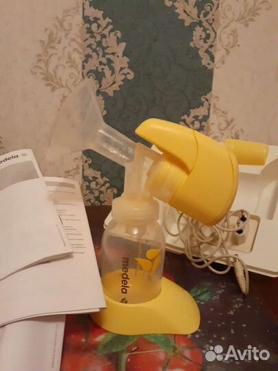 Молокоотсос medela электрический