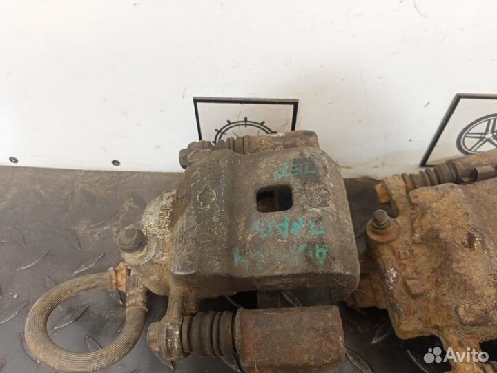 Суппорт тормозной передний для Nissan Almera N15