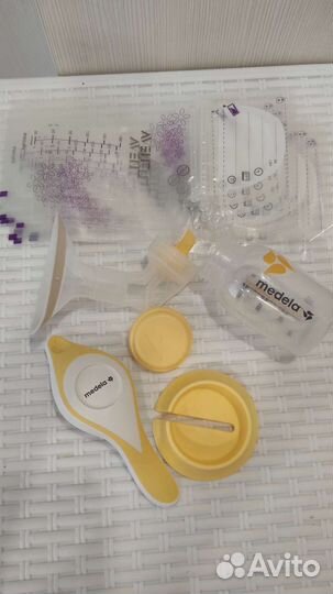 Молокоотсос medela ручной и пакеты для молока