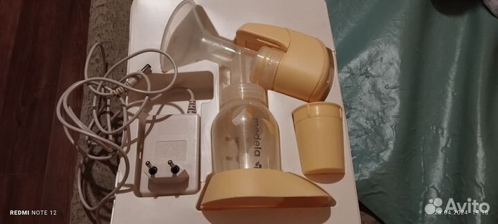 Молокоотсос medela электрический