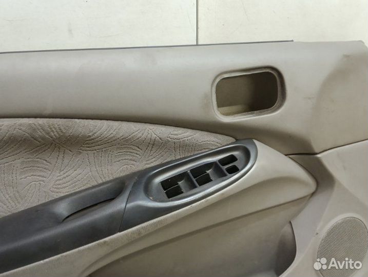 Обшивка двери передняя левая Nissan Almera N16 1.8
