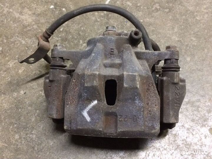 Суппорт тормозной левый Тойота Королла 150