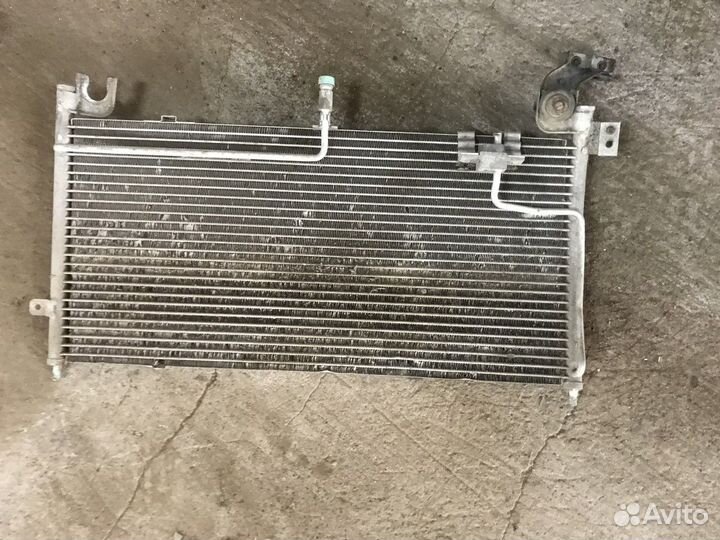 Радиатор кондиционера (конденсер) (Mazda 323)