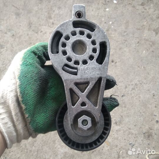 Натяжной ролик VW Passat b6 BKP tdi 2л