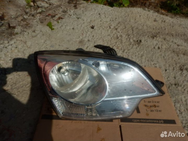 Стекло фары правой Opel Antara