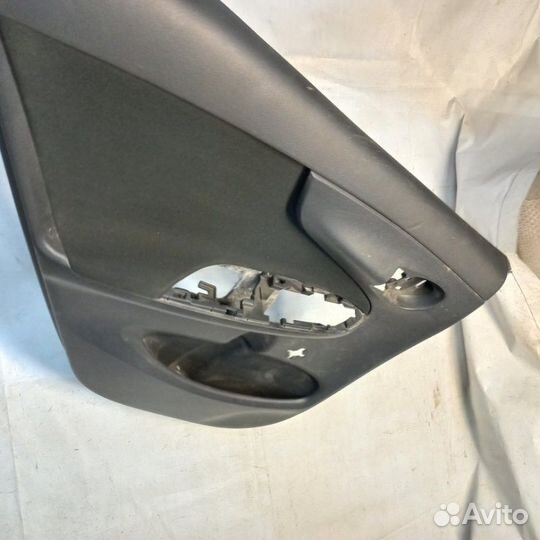 Обшивка двери задняя левая Toyota Corolla E150