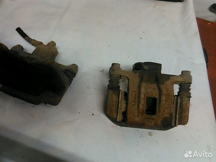 Суппорт задний левый Шевролет Лачетти