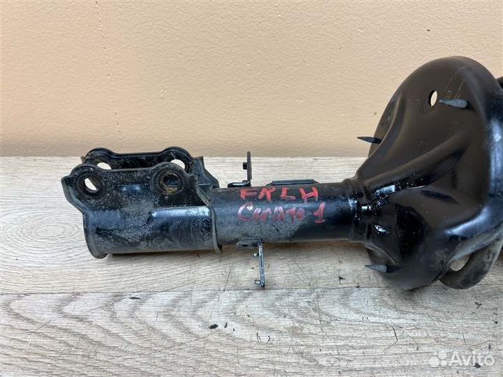 Амортизатор передний левый Kia Cerato 1 1.6 АКПП