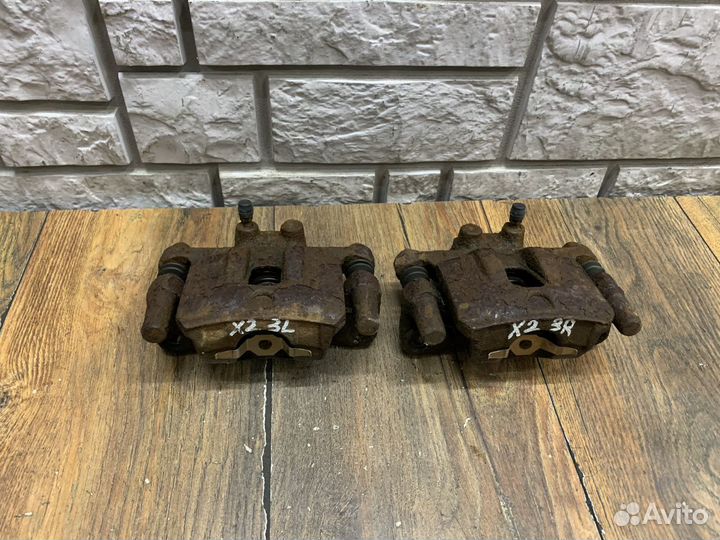 Mitsubishi Lancer 10 Суппорт тормозной задний