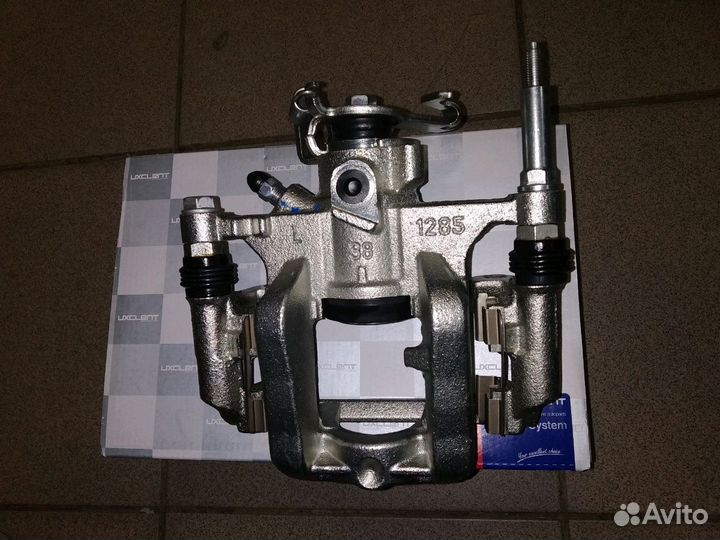 Суппорт тормозной Опель Астра J задний левый