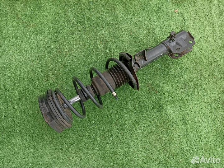 Стойка в сборе передняя левая Nissan Micra K12