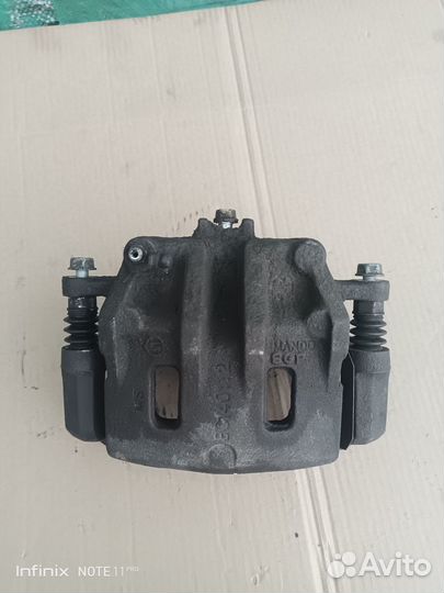 Суппорт тормозной передний правый Kyron 2009 г