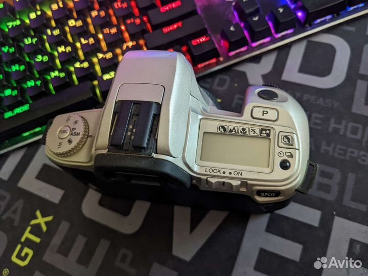 Плёночная зеркалка Minolta 404si