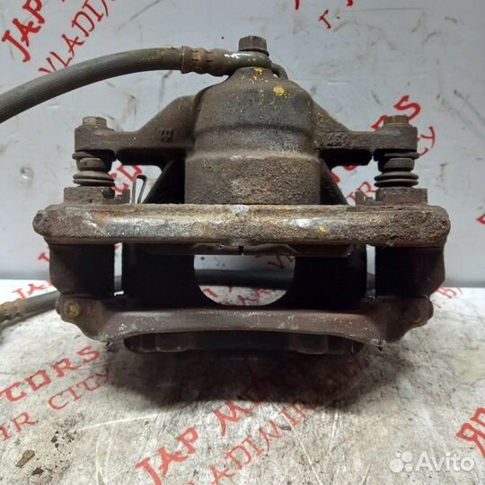Суппорт тормозной передний левый Toyota Avensis