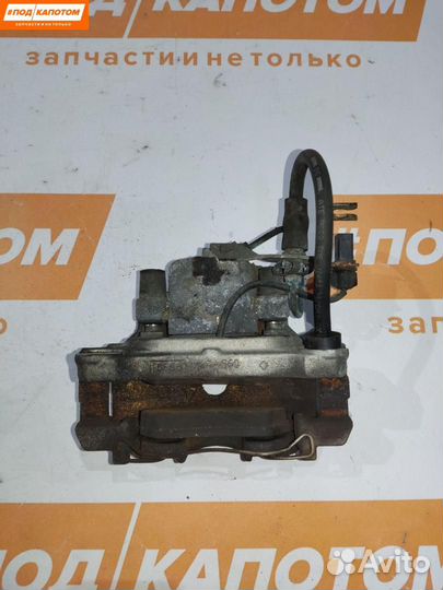 Суппорт тормозной передний левый Volkswagen Passat