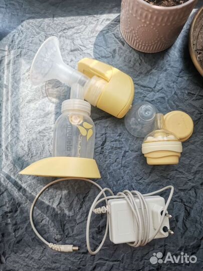 Молокоотсос medela электрический