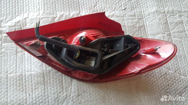 Фонарь левый Peugeot 207