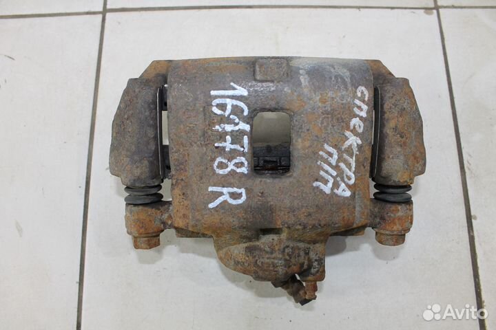 Суппорт тормозной Киа Спектра