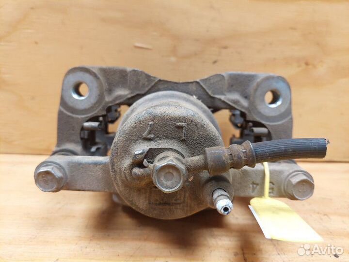 Суппорт передний левый Toyota Vitz KSP90 1krfe