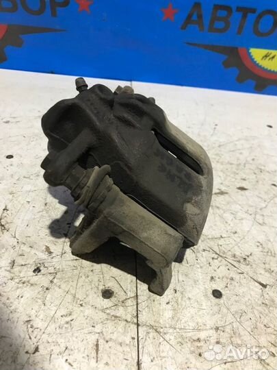 Суппорт передний правый Nissan Almera G15 K4MA490