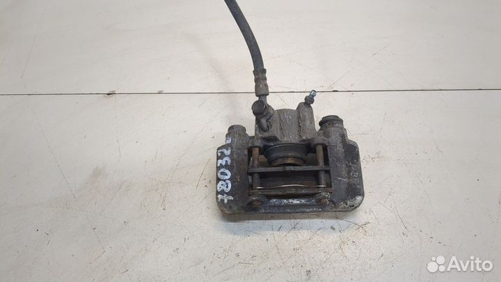 Суппорт левый задний Toyota Celica