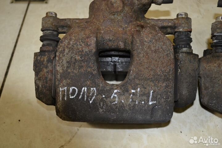 Тормозной суппорт передний левый Volkswagen Polo 5