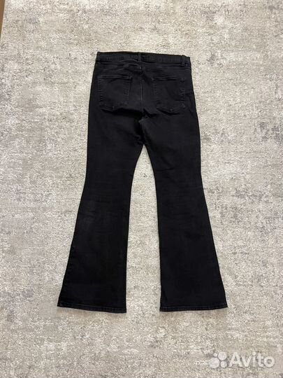 Джинсы клеш от колена черные