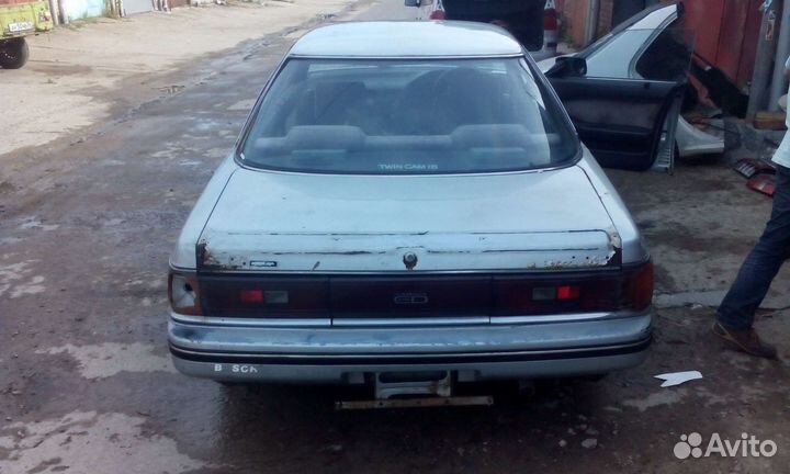 Бампер задний Toyota Carina ED St 162