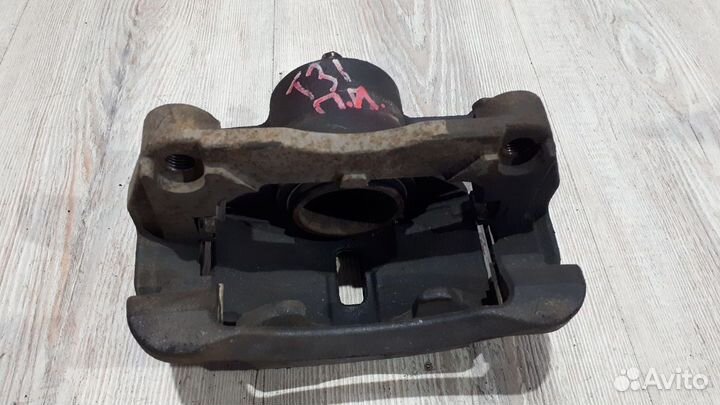 Суппорт тормозной перед Nissan X-trail T31 Лев