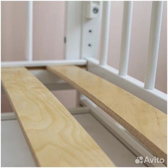 Детская кроватка с продольным маятником