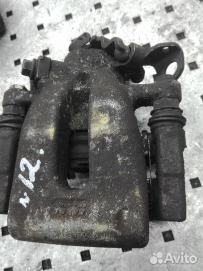 Суппорт задний левый Opel Astra H/Astra Family H