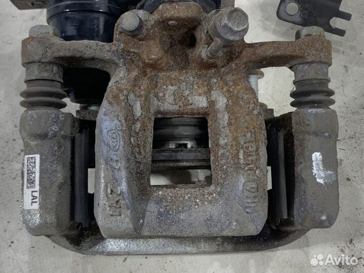 Суппорт тормозной задний левый KIA K5 DL3