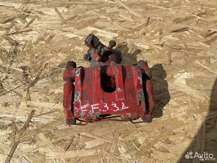 Тормозной суппорт задний левый Ford Focus 3