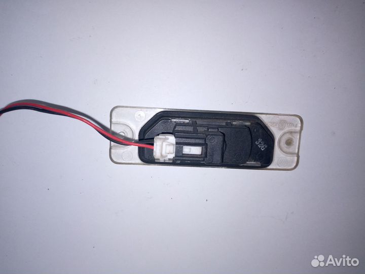 Фонарь подсветки номера Nissan Primera