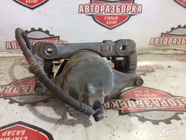 Суппорт тормозной передний левый Toyota Hiace