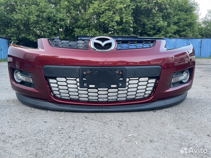 Бампер передний Mazda CX-7 2006-2008 до рест