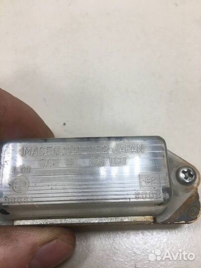 Фонарь подсветки номера Mitsubishi Colt